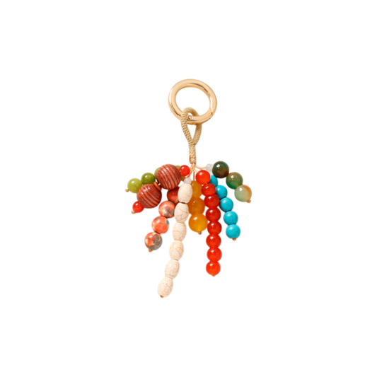 Colorful beaded keychain with a gold ring on a white background