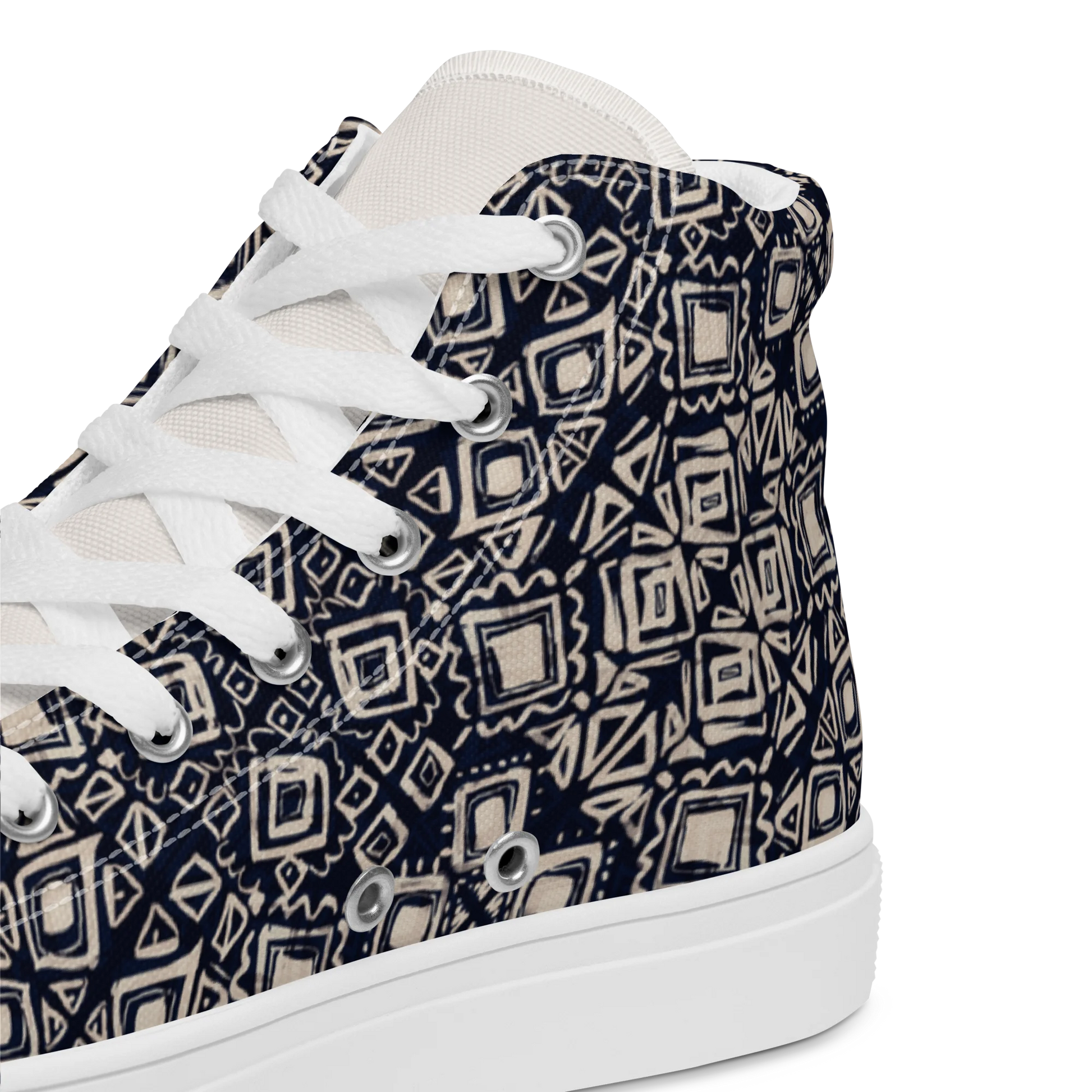 Made with a 100% polyester canvas upper, faux leather toe cap, breathable lining, removable insole, padded collar, lace-up front, and EVA rubber outsole. Designed with white soles and matching white laces. Finished with an all-over black and beige geometric sublimation print on the shoe quarters, plus custom branding on the tongue and inside label