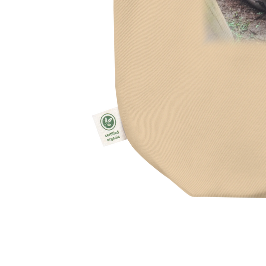 Made from 100% certified organic cotton 3/1 twill. Fabric weight: 8 oz/yd² (272 g/m²). Designed with an open main compartment, 1″ wide dual straps, and a 30 lb (13.6 kg) weight limit. Finished with a front DTG turtle photo print and the phrase “In No Rush.”