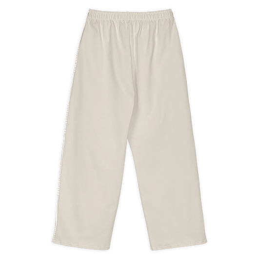 Made from 95% cotton and 5% elastane with a substantial fabric weight of 8.85 oz/yd² (300 g/m²). Designed with a relaxed unisex fit, wide legs, an elasticated waistband, and a medium-soft heavyweight feel. The front panels feature a warm ivory and white linear print, while the back remains solid warm ivory.