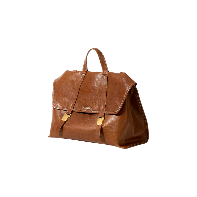 Brown leather bag with gold accents on a white background