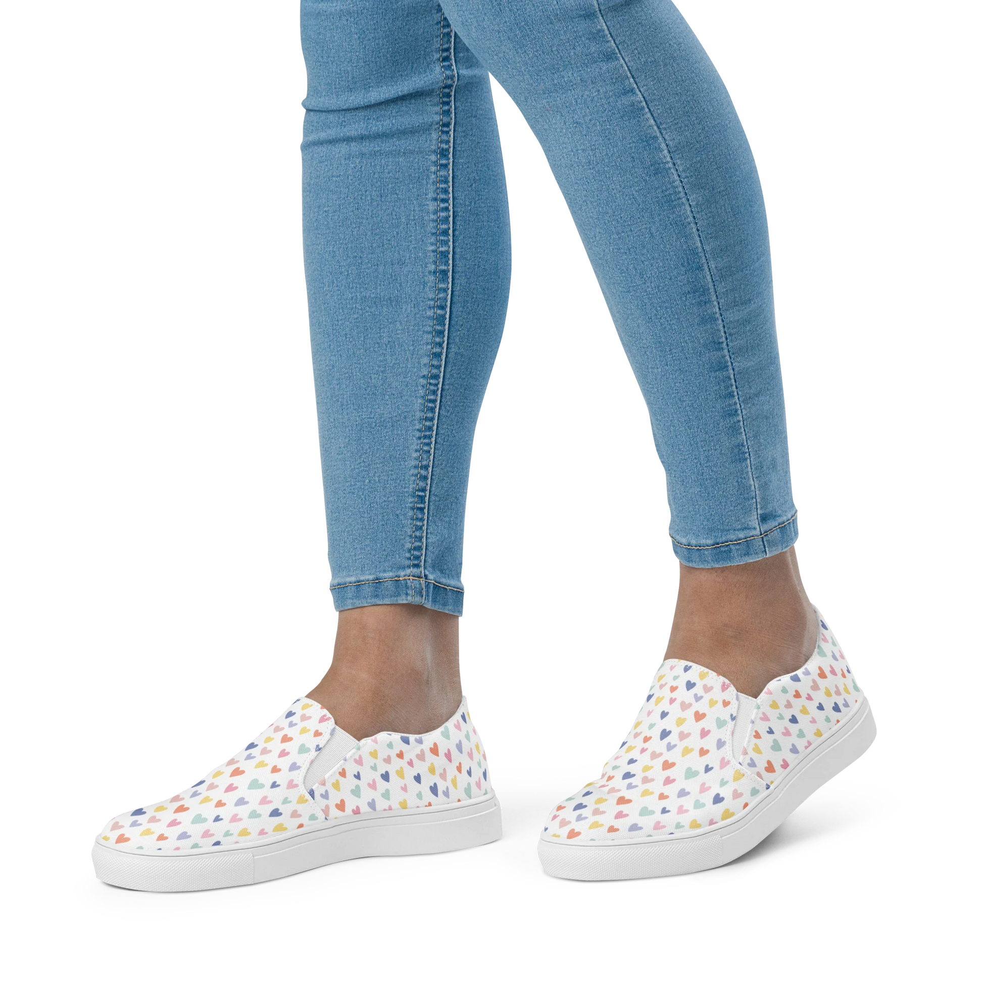 Made with a 100% polyester canvas upper, breathable lining, soft removable insole, elastic side accents, padded collar and tongue, and EVA rubber outsole. Designed with white soles and a slip-on silhouette. Finished with an all-over pastel hearts sublimation print.